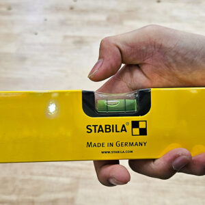 Spirit level STABILA type 70M combines rare-earth magnets, precision vials, durable frame, and protective caps into a comprehensive leveling instrument.