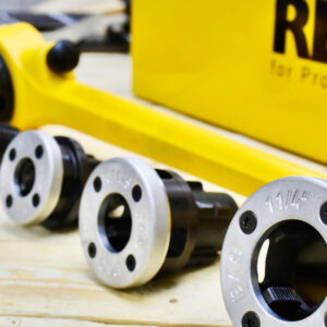 REMS eva hand die stock features steel ratchet lever, thick plastic coating, and serrated grip for secure operation.
